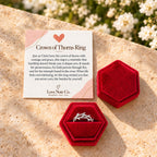 Crown of Thorns ring in its open gift box beside the card