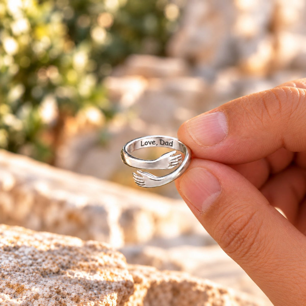 Dad and Daughter ring held up close